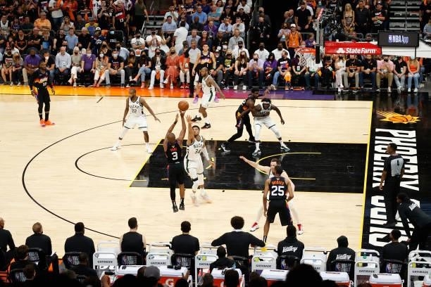 Chris Paul of the Phoenix Suns puts up a three-point shot over Giannis Antetokounmpo of the Milwaukee Bucks in the second half of game two of the NBA...