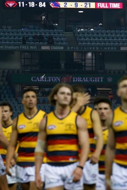 Dejected Adelaide Crows players walk off the ground after scoring the clubs lowest ever score in a match during the round 17 AFL match between...