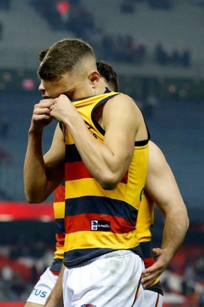 Dejected Adelaide Crows players walk off the ground after scoring the clubs lowest ever score in a match during the round 17 AFL match between...
