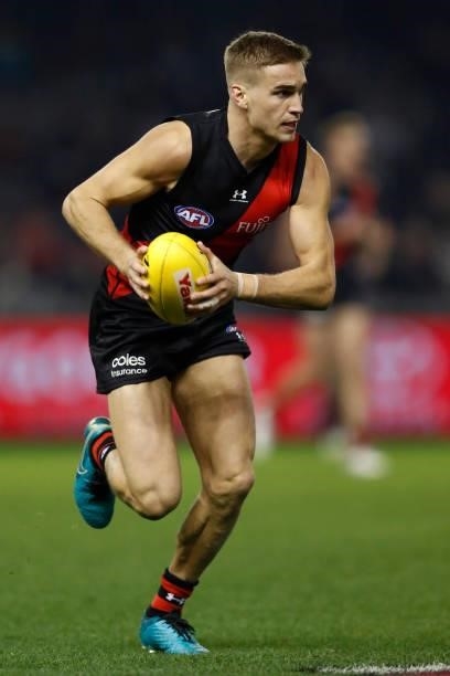 Matt Guelfi of the Bombers runs with the ball during the round 17 AFL match between Essendon Bombers and Adelaide Crows at Marvel Stadium on July 09,...