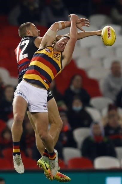 Tom Cutler of the Bombers spoils Sam Berry of the Crows during the round 17 AFL match between Essendon Bombers and Adelaide Crows at Marvel Stadium...