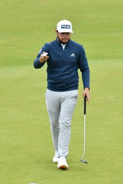 Tyrrell Hatton of England acknowledges the crowd on the 18th green during Day Two of the abrdn Scottish Open at The Renaissance Club on July 09, 2021...