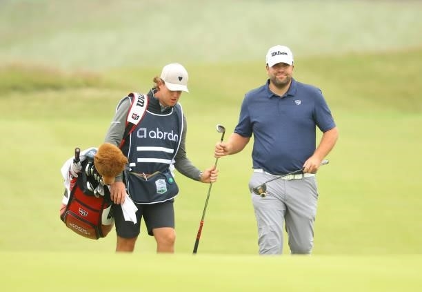 Jack Senior of England walks with his caddie on the 8th hole during Day Two of the abrdn Scottish Open at The Renaissance Club on July 09, 2021 in...