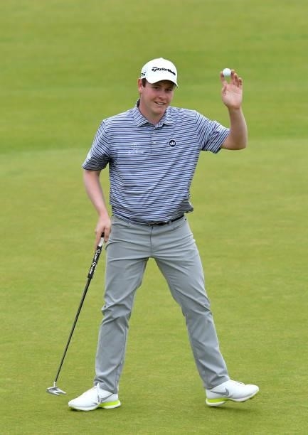 Robert MacIntyre of Scotland acknowledges the crowd on the 18th green during Day Two of the abrdn Scottish Open at The Renaissance Club on July 09,...