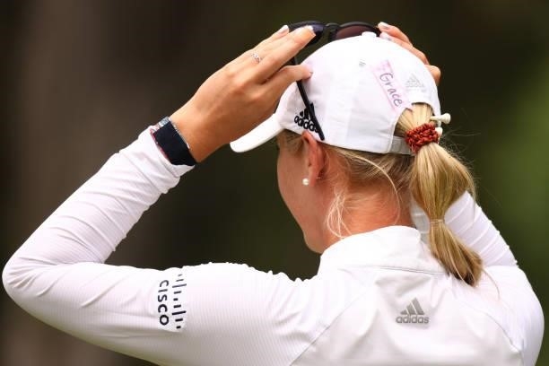 Jessica Korda displays a pink ribbon on her hat in honor of Grace Godfrey, the daughter of LPGA Tour player Jane Park and caddie Pete Godfrey, who is...