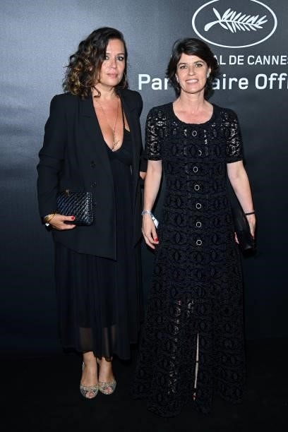 Irene Jacob and a guest attend the photocall ahead of the Chopard Trophy dinner during the 74th annual Cannes Film Festival on July 09, 2021 in...