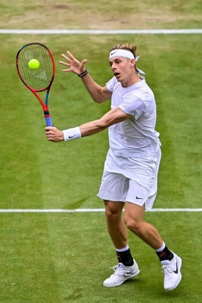 Dennis Shapovalov of Canada hits a backhand against Novak Djokovic of Serbia in the semi-finals of the gentlemen's singles during Day Eleven of The...