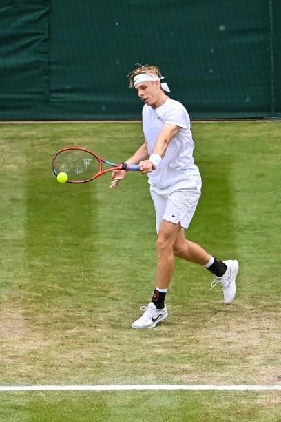 Dennis Shapovalov of Canada hits a backhand against Novak Djokovic of Serbia in the semi-finals of the gentlemen's singles during Day Eleven of The...