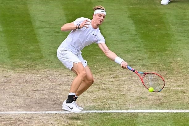Dennis Shapovalov of Canada hits a forehand against Novak Djokovic of Serbia in the semi-finals of the gentlemen's singles during Day Eleven of The...