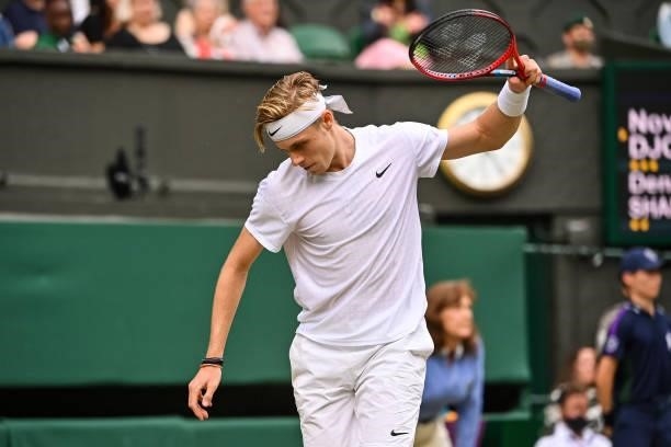 Dennis Shapovalov of Canada shows his frustration against Novak Djokovic of Serbia in the semi-finals of the gentlemen's singles during Day Eleven of...