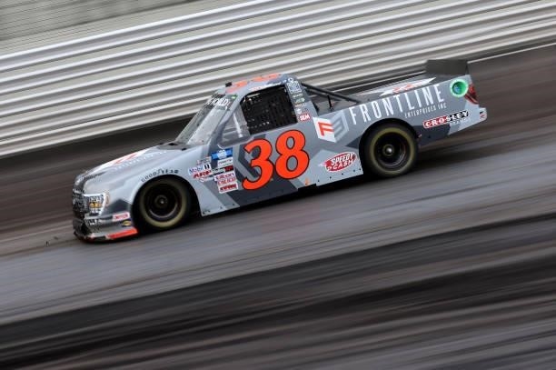 Todd Gilliland, driver of the Frontline Enterprises Inc. Ford, drives during qualifying for the NASCAR Camping World Truck Series Corn Belt 150...