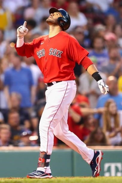 Martinez of the Boston Red Sox reacts as he crosses home plate after hitting a three-run home run in the second inning of a game against the...