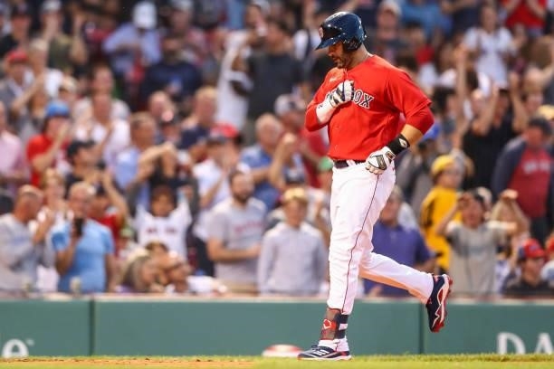 Martinez of the Boston Red Sox reacts as he rounds the bases after hitting a three-run home run in the second inning of a game against the...