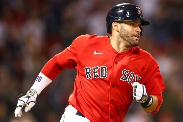 Martinez of the Boston Red Sox runs after hitting a double in the third inning of a game against the Philadelphia Phillies at Fenway Park on July 9,...