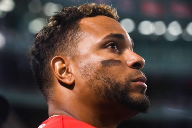 Xander Bogaerts of the Boston Red Sox looks on from the dugout during a game against the Philadelphia Phillies at Fenway Park on July 9, 2021 in...