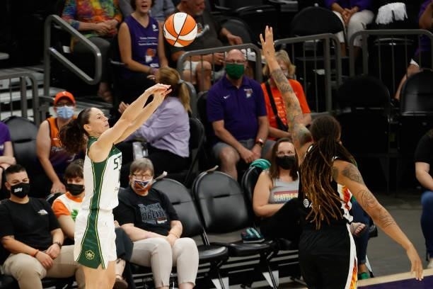 Sue Bird of the Seattle Storm attempts a shot over Brittney Griner of the Phoenix Mercury during the first half of the WNBA game at Phoenix Suns...