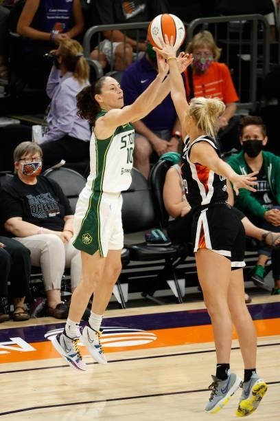 Sue Bird of the Seattle Storm attempts a shot over Sophie Cunningham of the Phoenix Mercury during the first half of the WNBA game at Phoenix Suns...