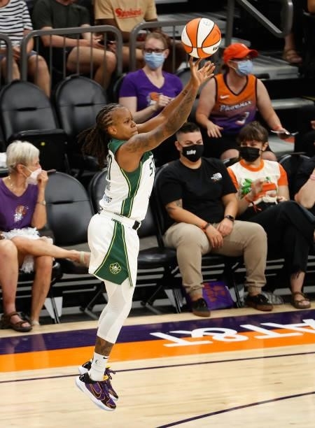 Epiphanny Prince of the Seattle Storm attempts a three-point shot against the Phoenix Mercury during the first half of the WNBA game at Phoenix Suns...