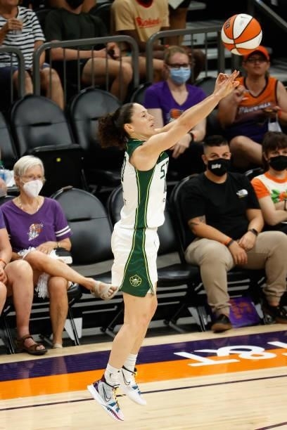 Sue Bird of the Seattle Storm attempts a three-point shot against the Phoenix Mercury during the first half of the WNBA game at Phoenix Suns Arena on...