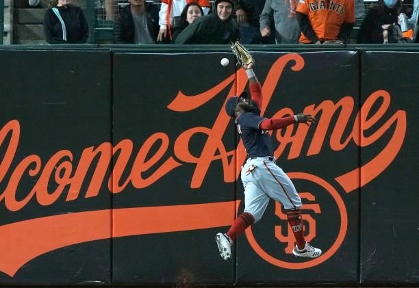 Josh Harrison of the Washington Nationals fails to catch a double off Curt Casali of the San Francisco Giants in the bottom of the six inning at...