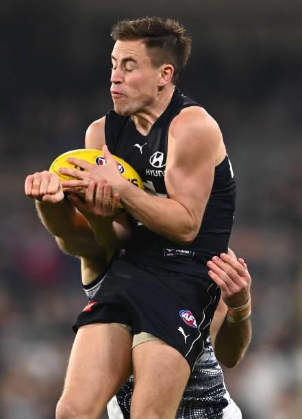 Matthew Owies of the Blues marks during the round 17 AFL match between Carlton Blues and Geelong Cats at Melbourne Cricket Ground on July 10, 2021 in...