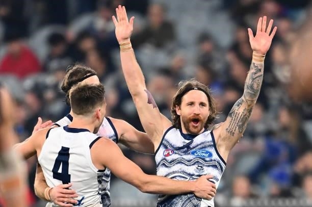 Zach Tuohy of the Cats is congratulated by team mates after kicking a goal during the round 17 AFL match between Carlton Blues and Geelong Cats at...