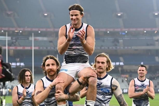 Lachie Henderson of the Cats is chaired off in his 200th game during the round 17 AFL match between Carlton Blues and Geelong Cats at Melbourne...