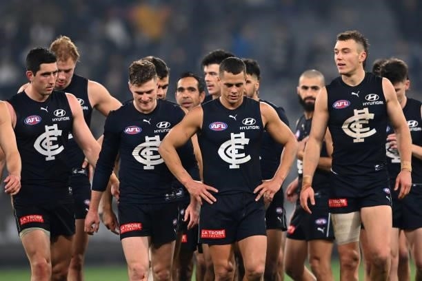 The Blues look dejected after losing the round 17 AFL match between Carlton Blues and Geelong Cats at Melbourne Cricket Ground on July 10, 2021 in...