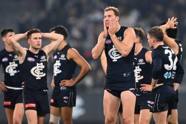 Harry McKay and his Blues team mates look dejected after losing the round 17 AFL match between Carlton Blues and Geelong Cats at Melbourne Cricket...