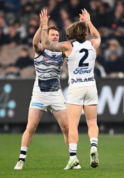 Zach Tuohy of the Cats is congratulated by Gary Rohan after kicking a goal during the round 17 AFL match between Carlton Blues and Geelong Cats at...