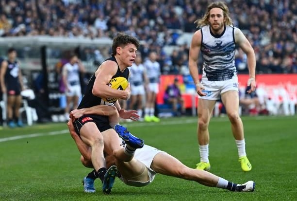 Sam Walsh of the Blues is tackled by Mark O'Connor of the Cats during the round 17 AFL match between Carlton Blues and Geelong Cats at Melbourne...