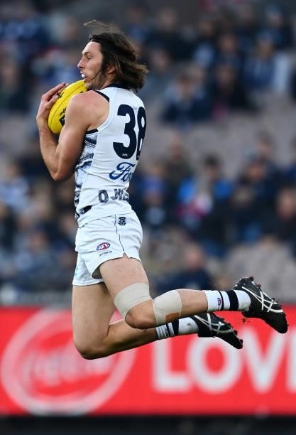 Jack Henry of the Cats marks during the round 17 AFL match between Carlton Blues and Geelong Cats at Melbourne Cricket Ground on July 10, 2021 in...