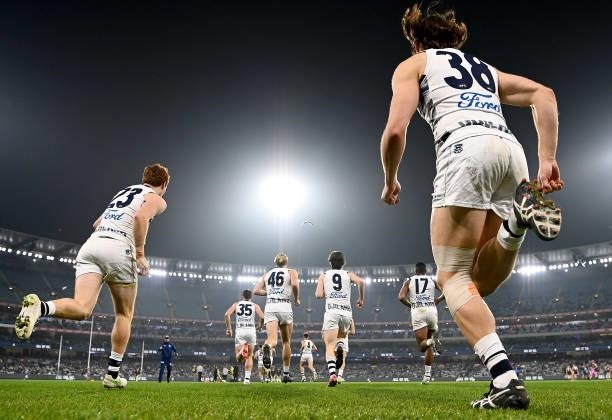 Jack Henry of the Cats runs out onto the field during the round 17 AFL match between Carlton Blues and Geelong Cats at Melbourne Cricket Ground on...