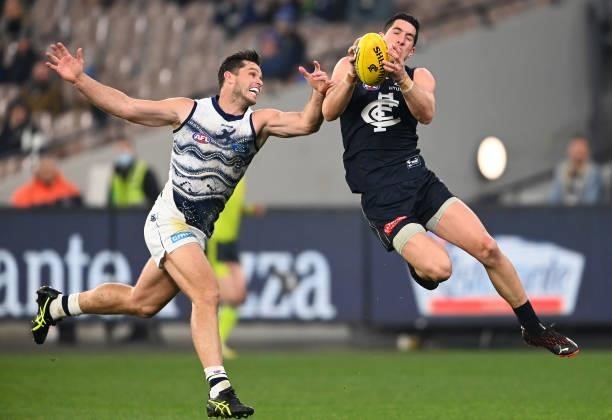 Jacob Weitering of the Blues marks infront of Tom Hawkins of the Cats during the round 17 AFL match between Carlton Blues and Geelong Cats at...