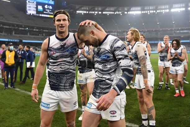 Lachie Henderson and Sam Menegola of the Cats celebrate winning the round 17 AFL match between Carlton Blues and Geelong Cats at Melbourne Cricket...