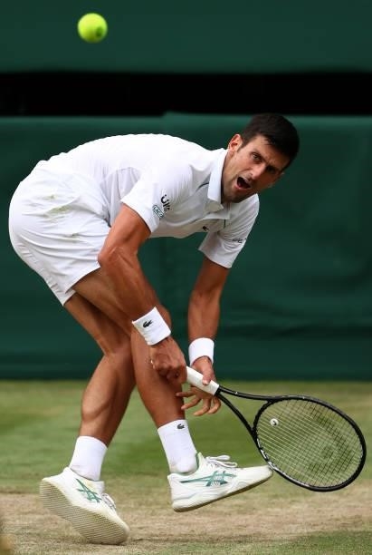Novak Djokovic of Serbia plays a backhand in his Men's Singles Semi-Final match against Denis Shapovalov of Canada during Day Eleven of The...
