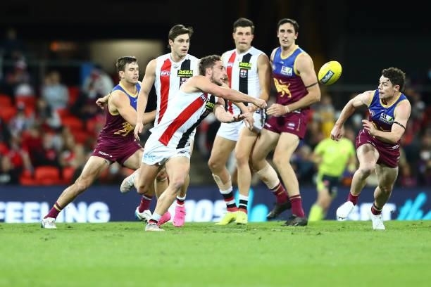 Luke Dunstan of the Saints handballs during the round 17 AFL match between Brisbane Lions and St Kilda Saints at The Gabba on July 10, 2021 in...