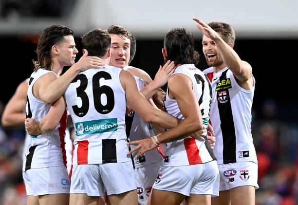 Ben Long of the Saints is congratulated by team mates after kicking a goal during the round 17 AFL match between Brisbane Lions and St Kilda Saints...