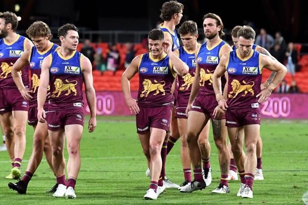 Dayne Zorko of the Lions and team mates look dejected after losing the round 17 AFL match between Brisbane Lions and St Kilda Saints at The Gabba on...