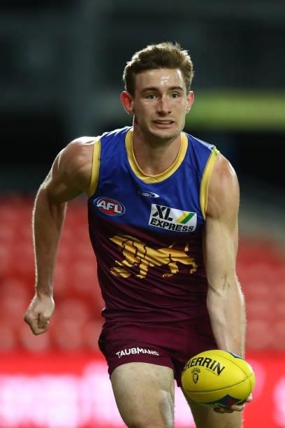 Harris Andrews of the Lions handballs during the round 17 AFL match between Brisbane Lions and St Kilda Saints at The Gabba on July 10, 2021 in...