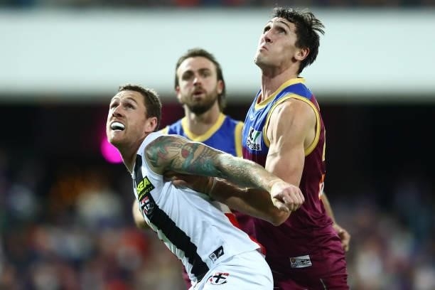 Tim Membrey of the Saints Oscar McInerney of the Lions compete for the ball during the round 17 AFL match between Brisbane Lions and St Kilda Saints...