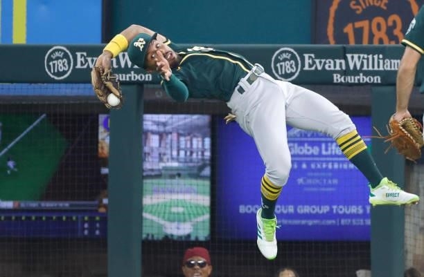 Tony Kemp of the Oakland Athletics makes a backward, leaping catch for an out off the bat of Isiah Kiner-Falefa of the Texas Rangers during the first...