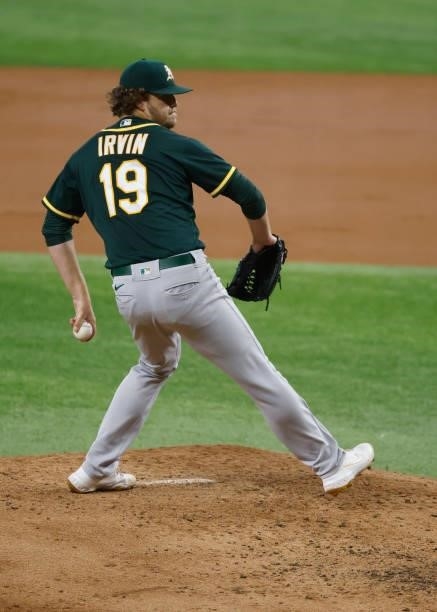 Cole Irvin of the Oakland Athletics delivers against the Texas Rangers during the second inning at Globe Life Field on July 9, 2021 in Arlington,...