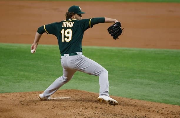 Cole Irvin of the Oakland Athletics delivers against the Texas Rangers during the second inning at Globe Life Field on July 9, 2021 in Arlington,...