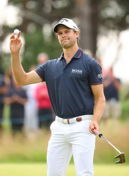 Thomas Detry of Belgium acknowledges the crowd on the 17th green during Day Three of the abrdn Scottish Open at The Renaissance Club on July 10, 2021...