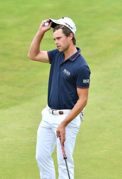 Thomas Detry of Belgium acknowledges the crowd on the 18th green during Day Three of the abrdn Scottish Open at The Renaissance Club on July 10, 2021...