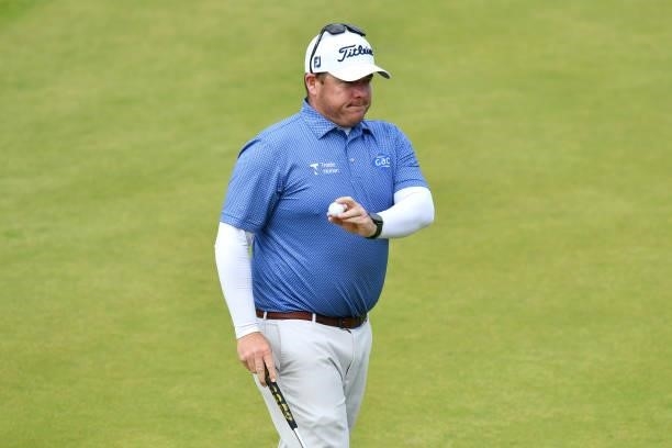 George Coetzee of South Africa acknowledges the crowd on the 18th green during Day Three of the abrdn Scottish Open at The Renaissance Club on July...
