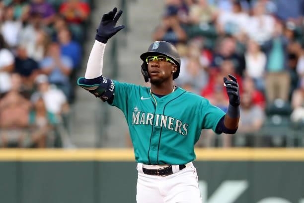 Shed Long Jr. #4 of the Seattle Mariners celebrates after hitting a two-run double during the fourth inning against the Los Angeles Angels at...