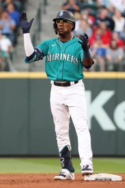 Shed Long Jr. #4 of the Seattle Mariners celebrates after hitting a two-run double during the fourth inning against the Los Angeles Angels at...