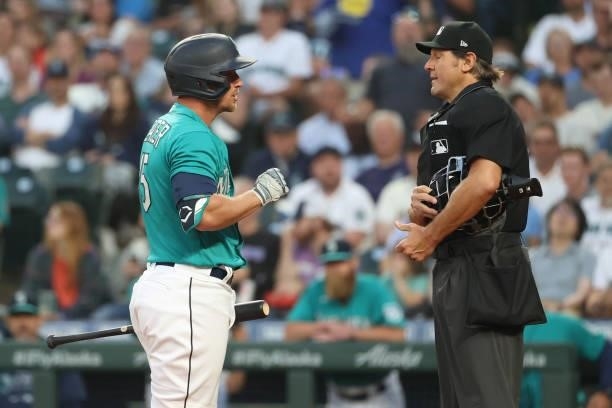 Kyle Seager of the Seattle Mariners argues with the home plate umpire after striking out to end the fifth inning against the Los Angeles Angels at...